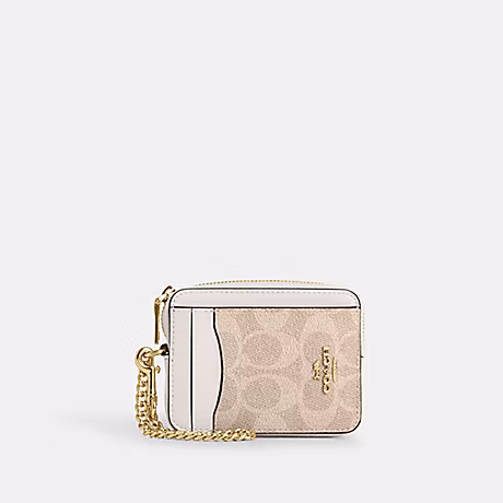 COACH ZIP CARD CASE IN SIGNATURE CANVAS